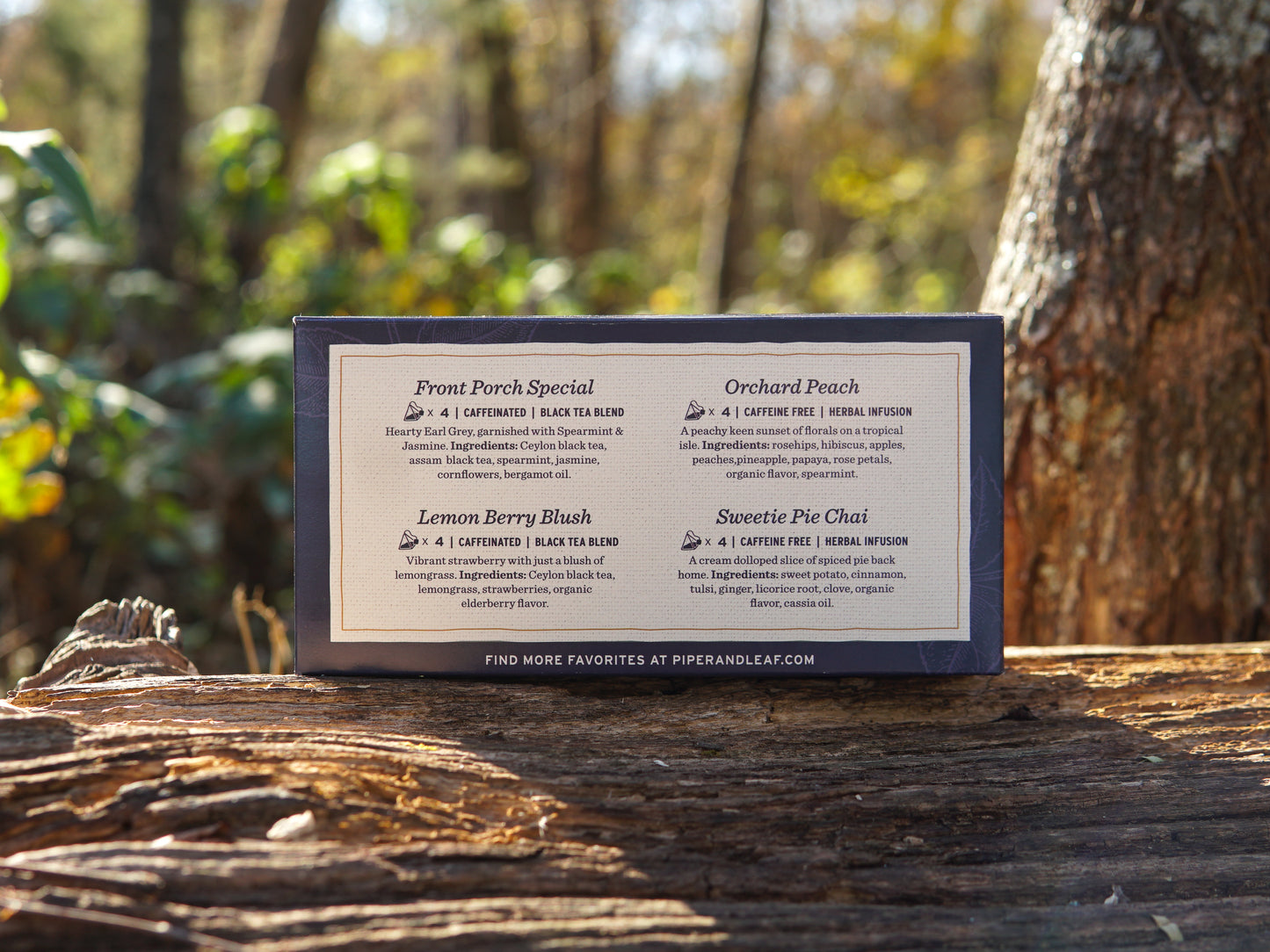A Piper & Leaf Tea Co. Bestsellers Tea Sampler box featuring 16 tea bags is shown outdoors, displaying descriptions of four blends: Front Porch Special, Orchard Peach, Lemon Berry Blush, and Sweetie Pie Chai.